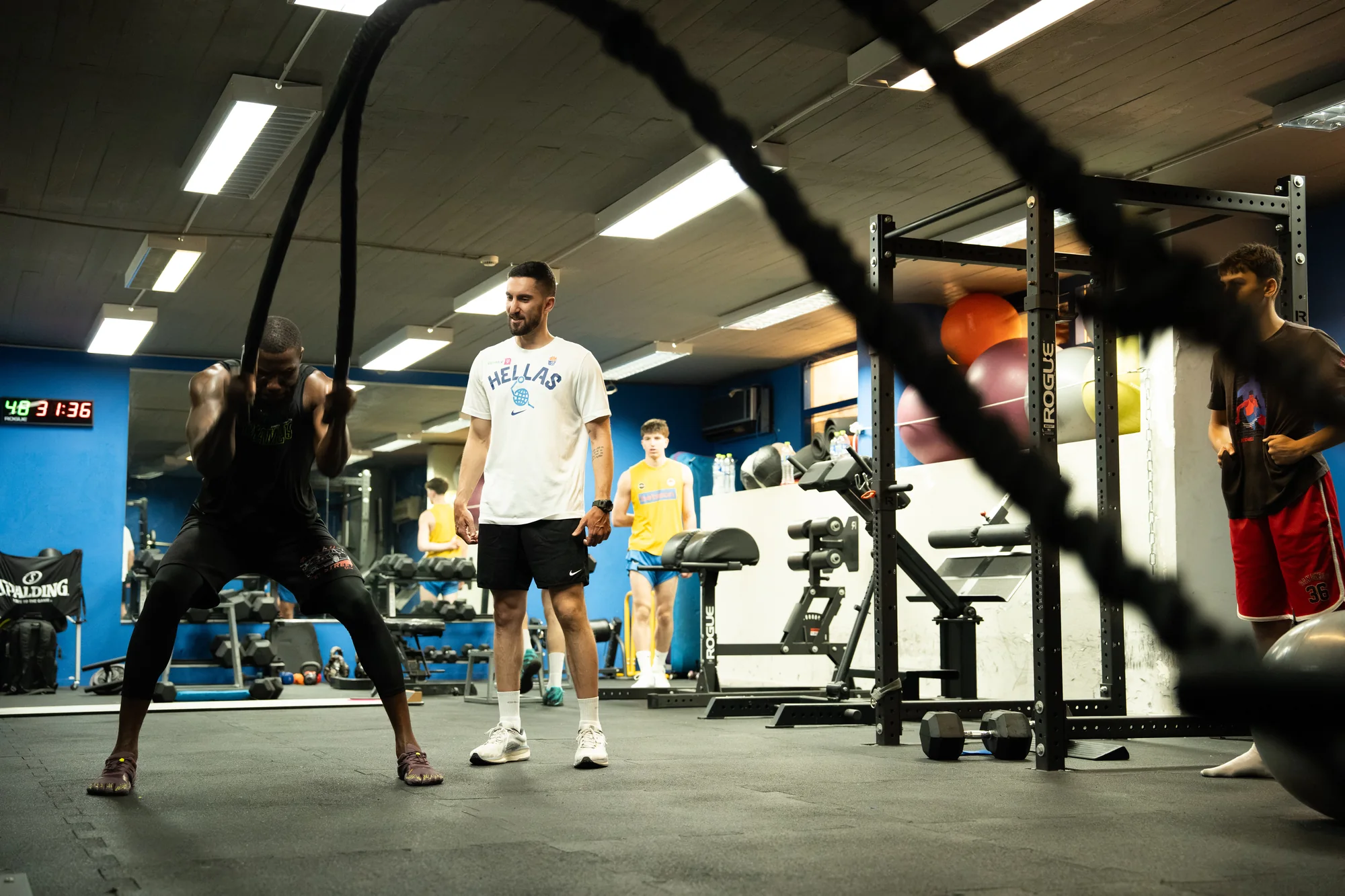 Georgios overseeing an athlete's battle-rope performance training